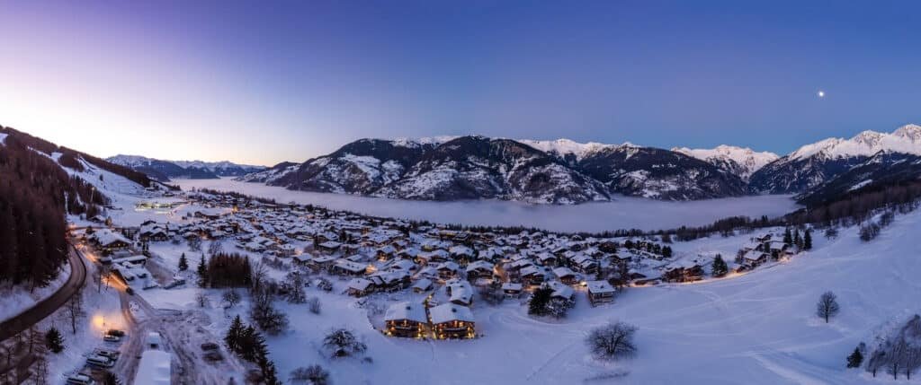 Panoramic shot of Le Praz at sunset with cloud inversion