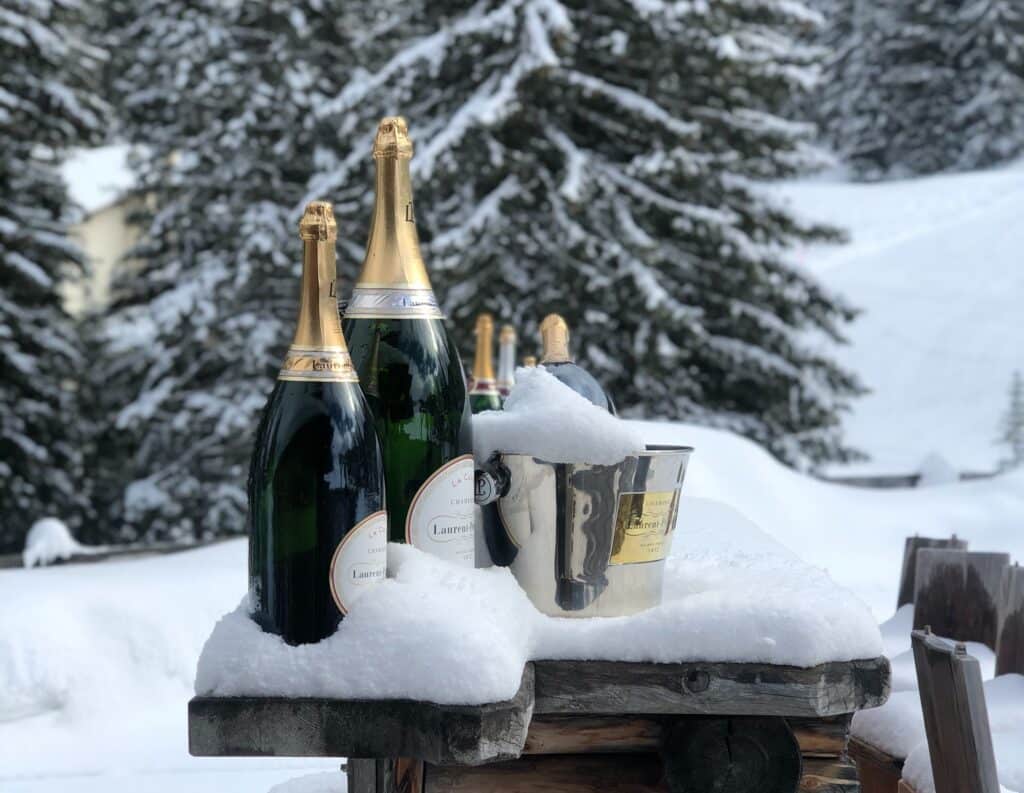 celebrations with champagne in the snow in courchevel